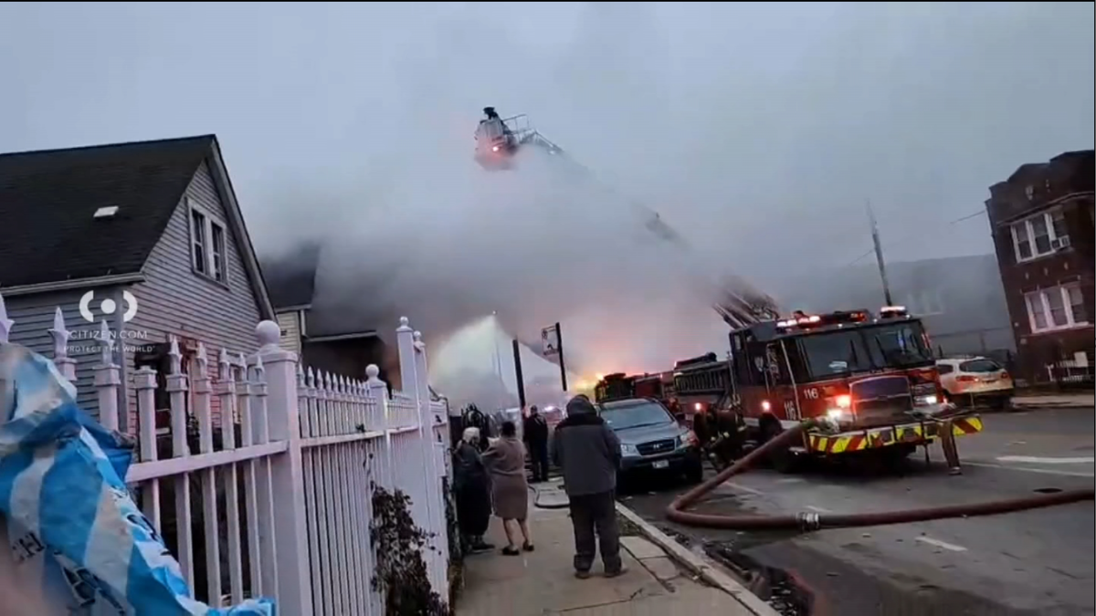 Smoke rising from a fire engulfed a block of Chicago's West Englewood neighborhood Tuesday afternoon, video posted to social media showed.